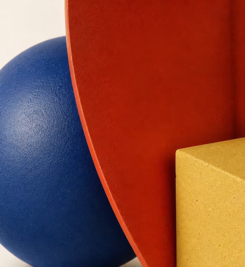 Blue sphere, red disc and yellow block as a still life